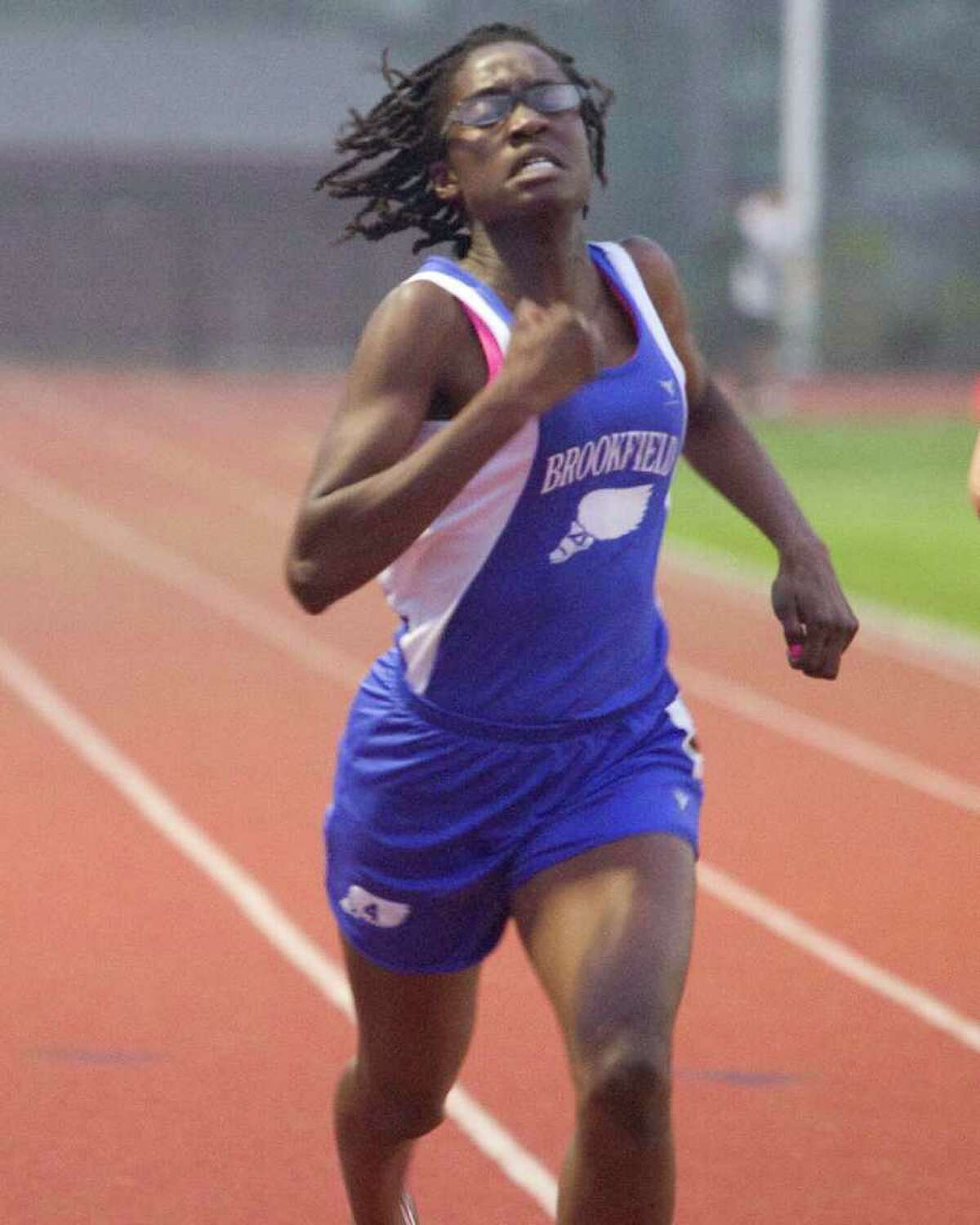 Brookfield's Djenne Parris wins the 200 meters at the SWC Track and Field Championships Monday at Bethel High School.