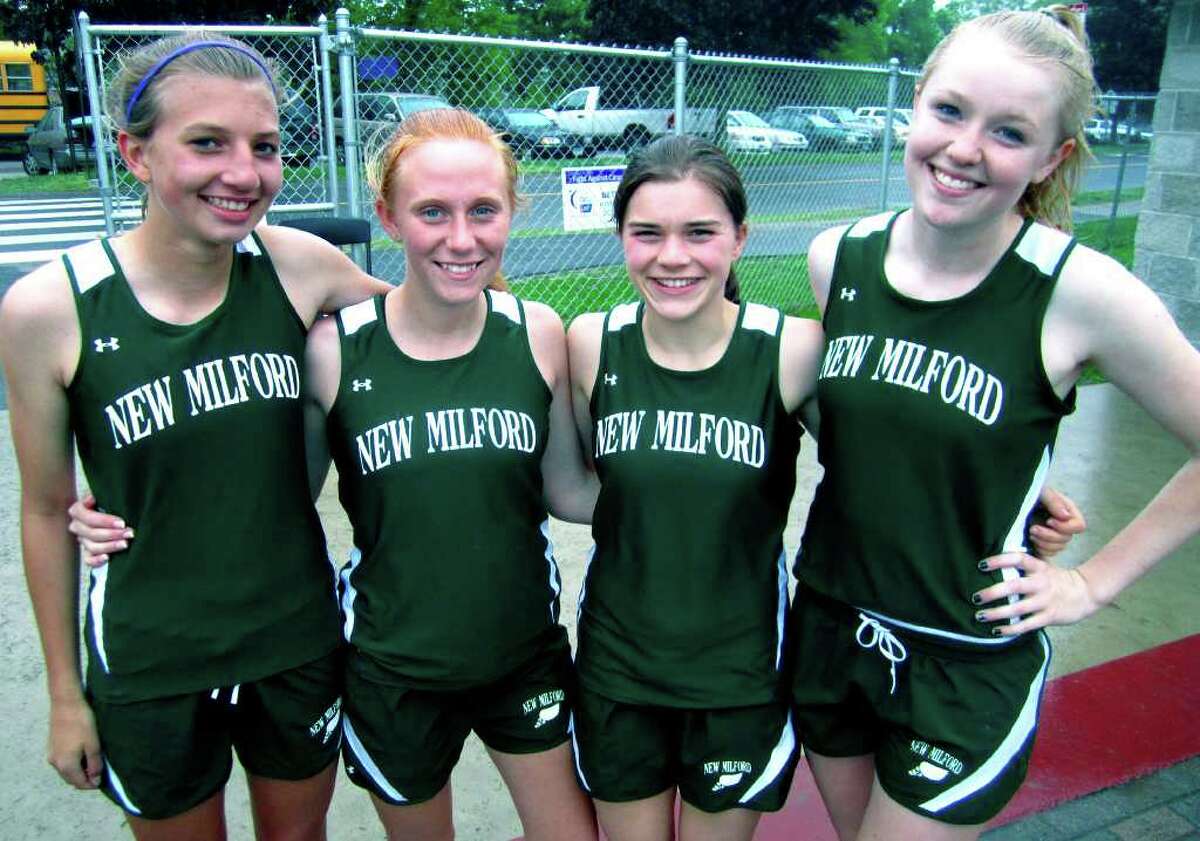 SPECTRUM/Celebrating their victory in the 4 x 800-meter relay at the May 23, 2011 South-West Conference meet at Bethel High School are, from left to right, New Milford High School girls' track teammates Sierra Grazia, Rachel Watson, Gabby Passarelli and Erin Kersten. The Green Wave quartet outclassed the field with a time of 9:45.6.