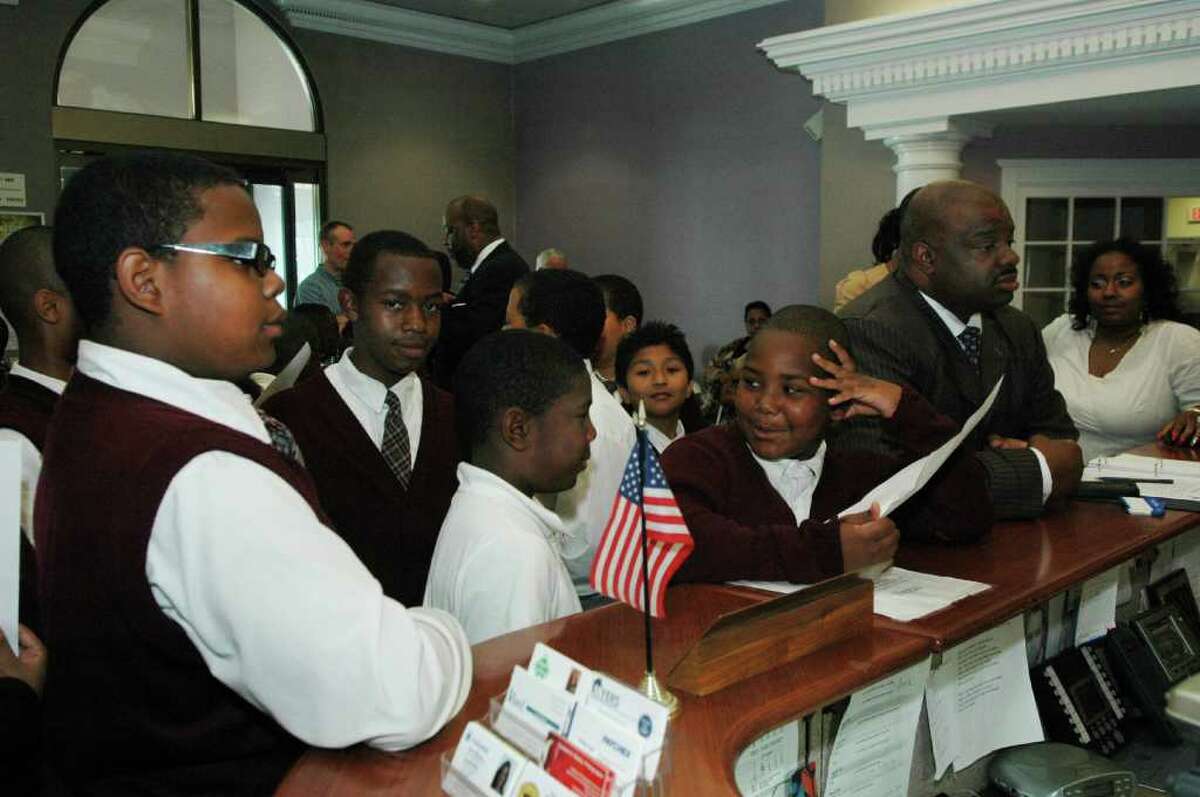 The Rev. Kenneth Moales Jr. and students from Love Christian Academy in Bridgeport, Conn. deliver letters of protest to Mayor Finch's office on Thursday, May 26, 2011. The students, administrators and supporters wanted to make clear their objection to any deal that would allow the Mark IV Construction operation on Seaview Ave. to continue. The City cited progress today in a decision by Mark IV Construction to drop its appeal of a City cease and desist order regarding its rock crushing and fill operation on Seaview Ave. which the company now agrees to close by Dec. 1, 2011.