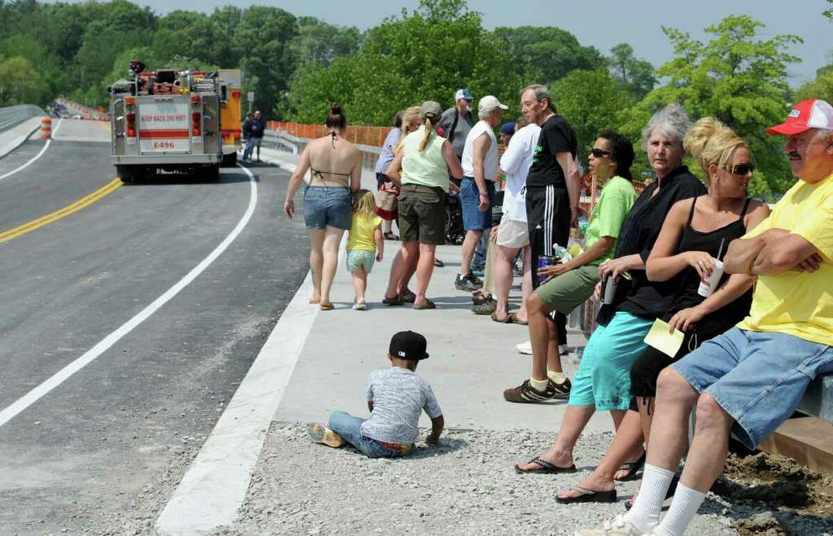 Neighbors and friends of neighbors line up to make the first walk across the bridge at the opening of the Route 9P Bridge at the north end of Saratoga Lake May 26, 2011. (Skip Dickstein / Times Union)