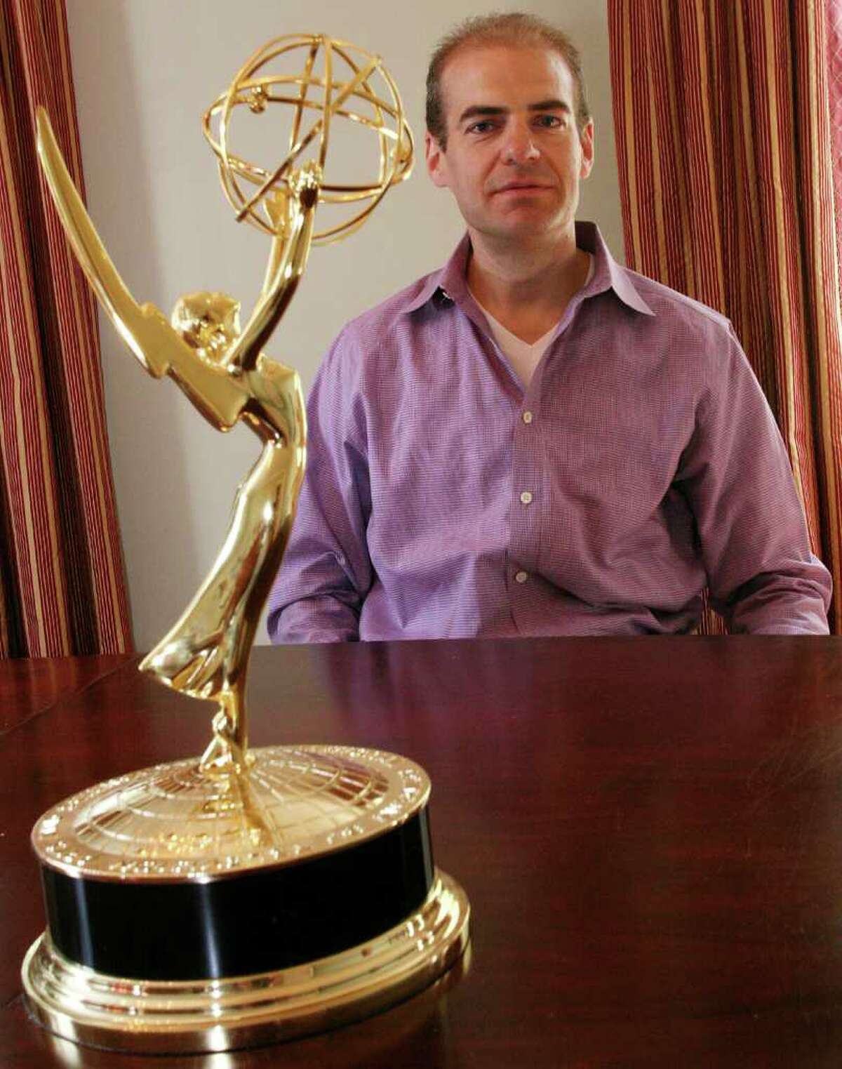 Longtime Greenwich resident Thomas Odelfelt seen here Friday, May 27, 2011, with the Sports Emmy he won last year for editing the program "24/7 Mayweather-Marquez." The Brunswick graduate recently won another sports Emmy this year in the Outstanding Edited Specials category for the program "24/7 Penquins-Capitals: Road to the NHL Winter Classic." That Emmy is being engraved.