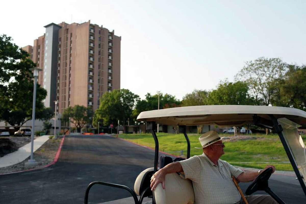 Retired Air Force Col. Ralph Kuster sits in his golf cart he uses to drive around Air Force Village I in San Antonio.