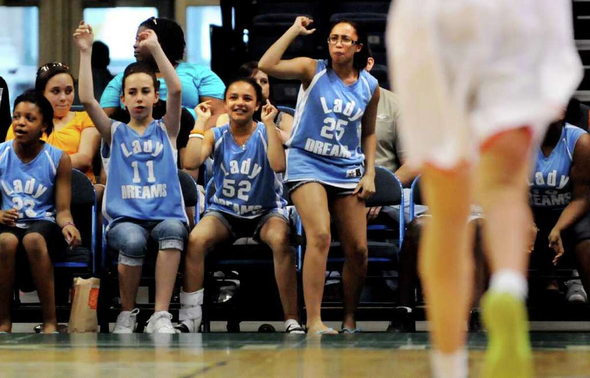 Members of the Lady Dreams AAU basketball team for 12-year-olds cheer for the New York Liberty WNBA team as they play Chinese National on Friday, May 27, 2011, at Times Union Center in Albany, N.Y. (Cindy Schultz / Times Union)