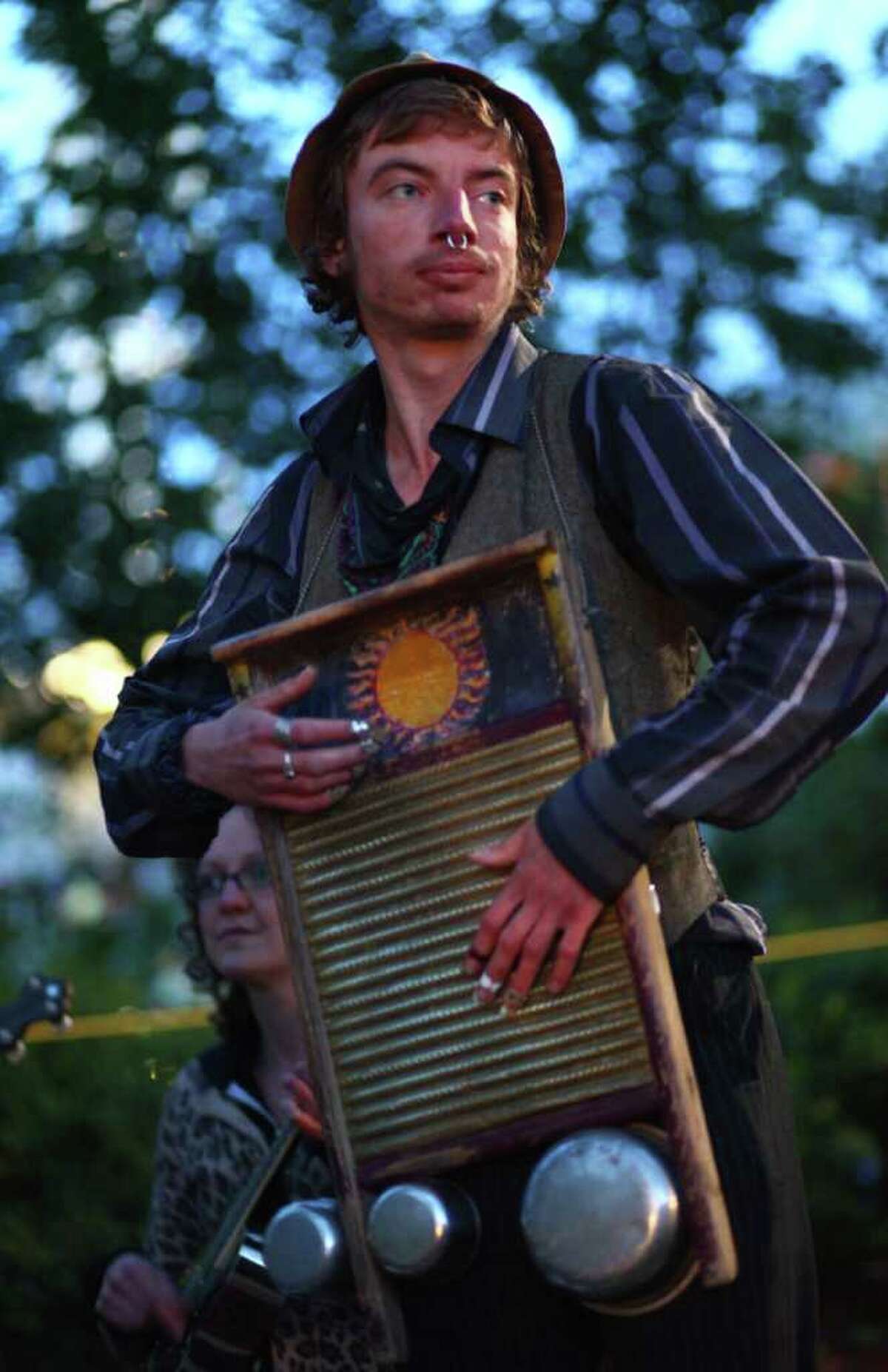 Po, of the band Same Old Use To Be's, plays a washboard and cans during the 40th annual Northwest Folklife Festival. Members of his band have been regular buskers at the festival for many years.