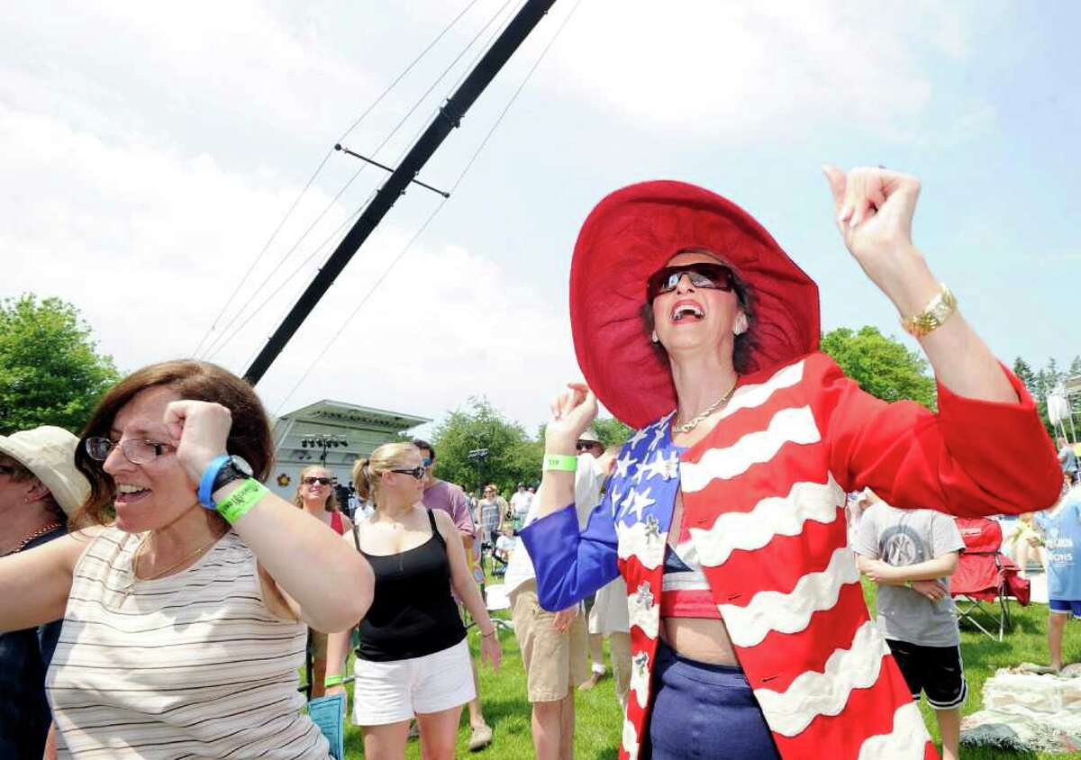 Cindy Castronovo-Morabito, right, dances to the music of Toots and the Maytals during the Greenwich Town Party in Roger Sherman Baldwin Park, Saturday afternoon, May 28, 2011.