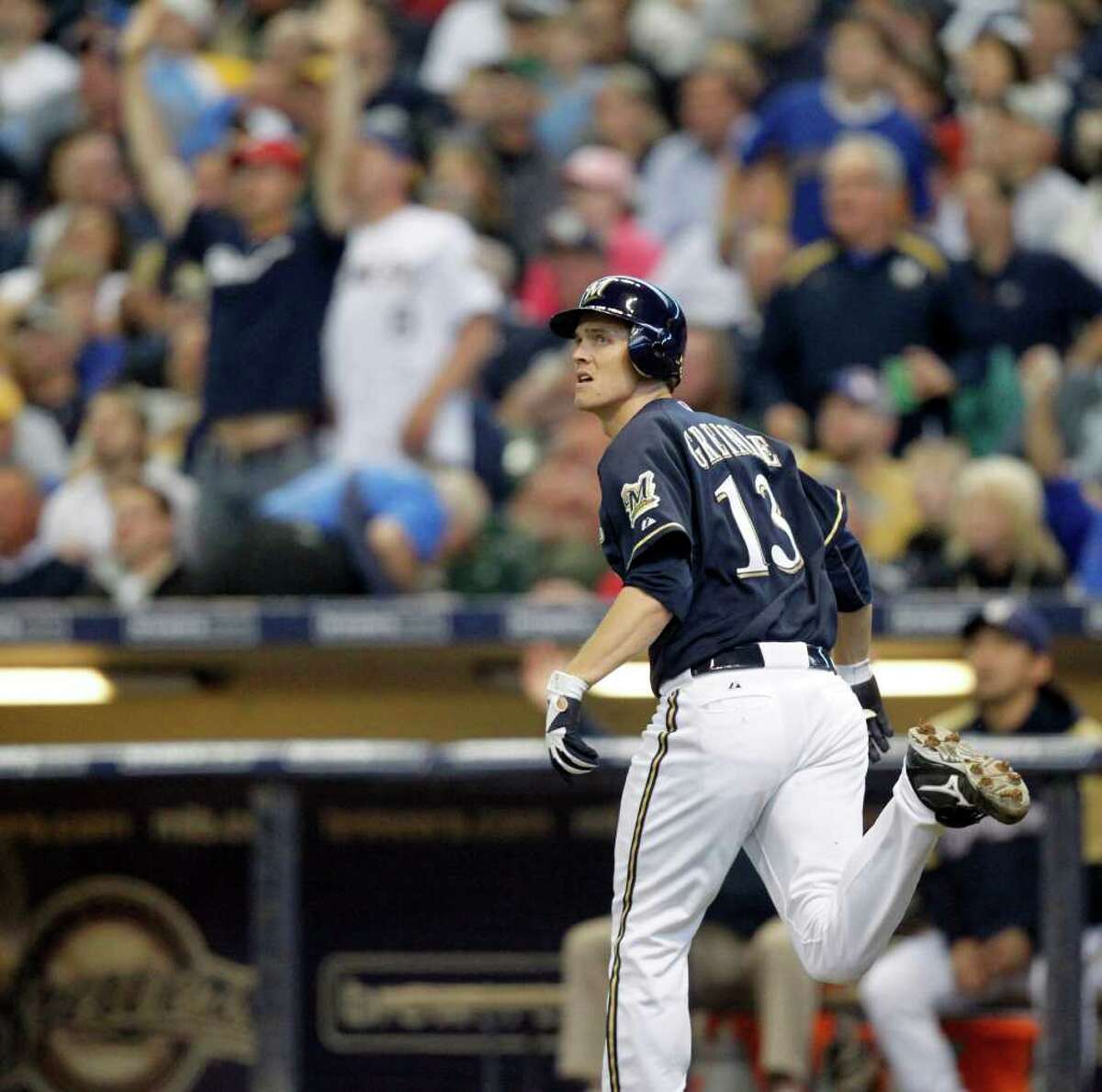 Brewers pitcher Zack Greinke watches his home run, off the Nationals’ Jason Marquis, leave Miller Park on Wednesday.