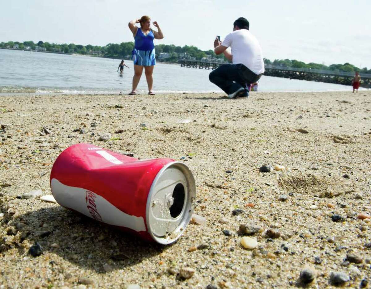 Trash lines the beach as summer kicks off with Memorial Day at Cummings Park in Stamford, Conn., May 30, 2011.