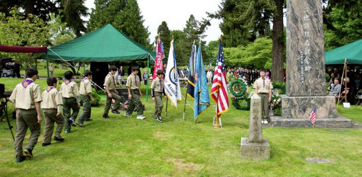 Boy Scout Troop 252 retires the colors at the Nisei Veteran memorial service at Seattle's Lake View Cemetery on Memorial Day.
