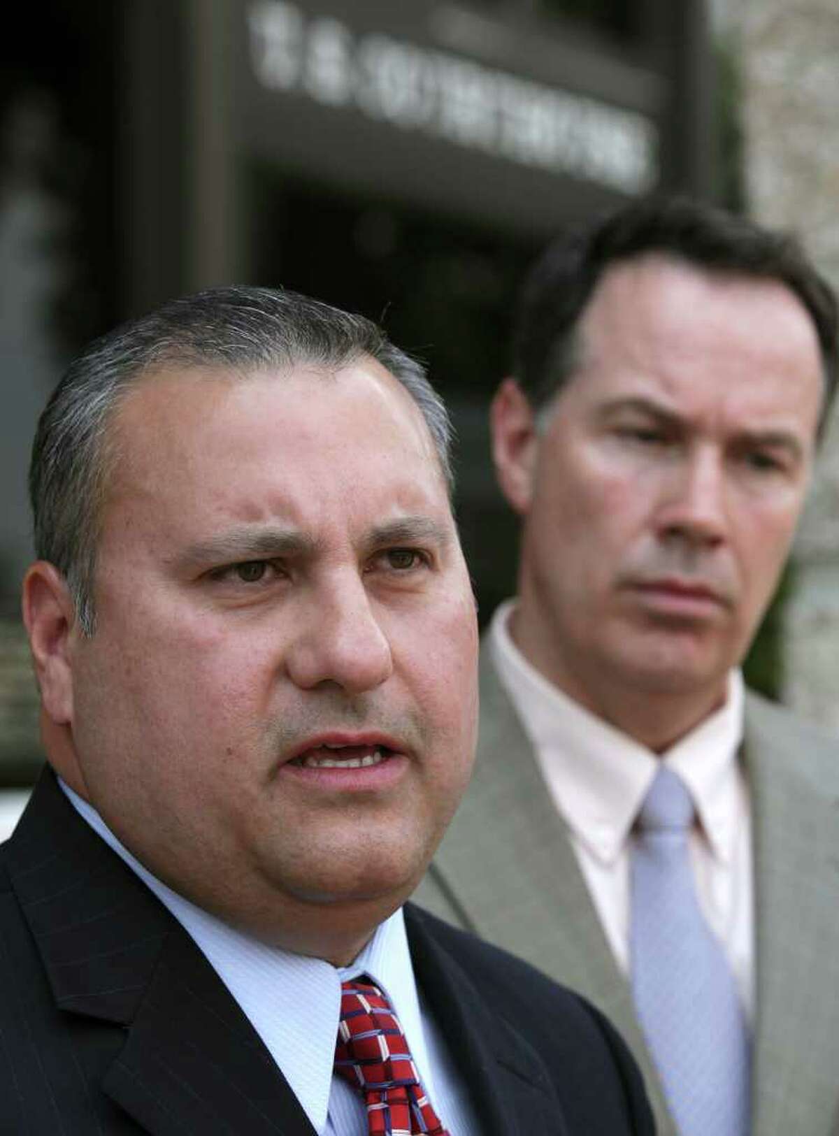 Chris Martinez, Assistant Superintendent Human Resources and Public Relations for Medina Valley ISD, speaks to the media following a hearing concerning the use of prayer in the Medina Valley High School's graduation ceremonies this Saturday. At right is the district's attorney, D. Craig Wood. Tuesday, May 31, 2011. Photo Bob Owen/rowen@express-news.net