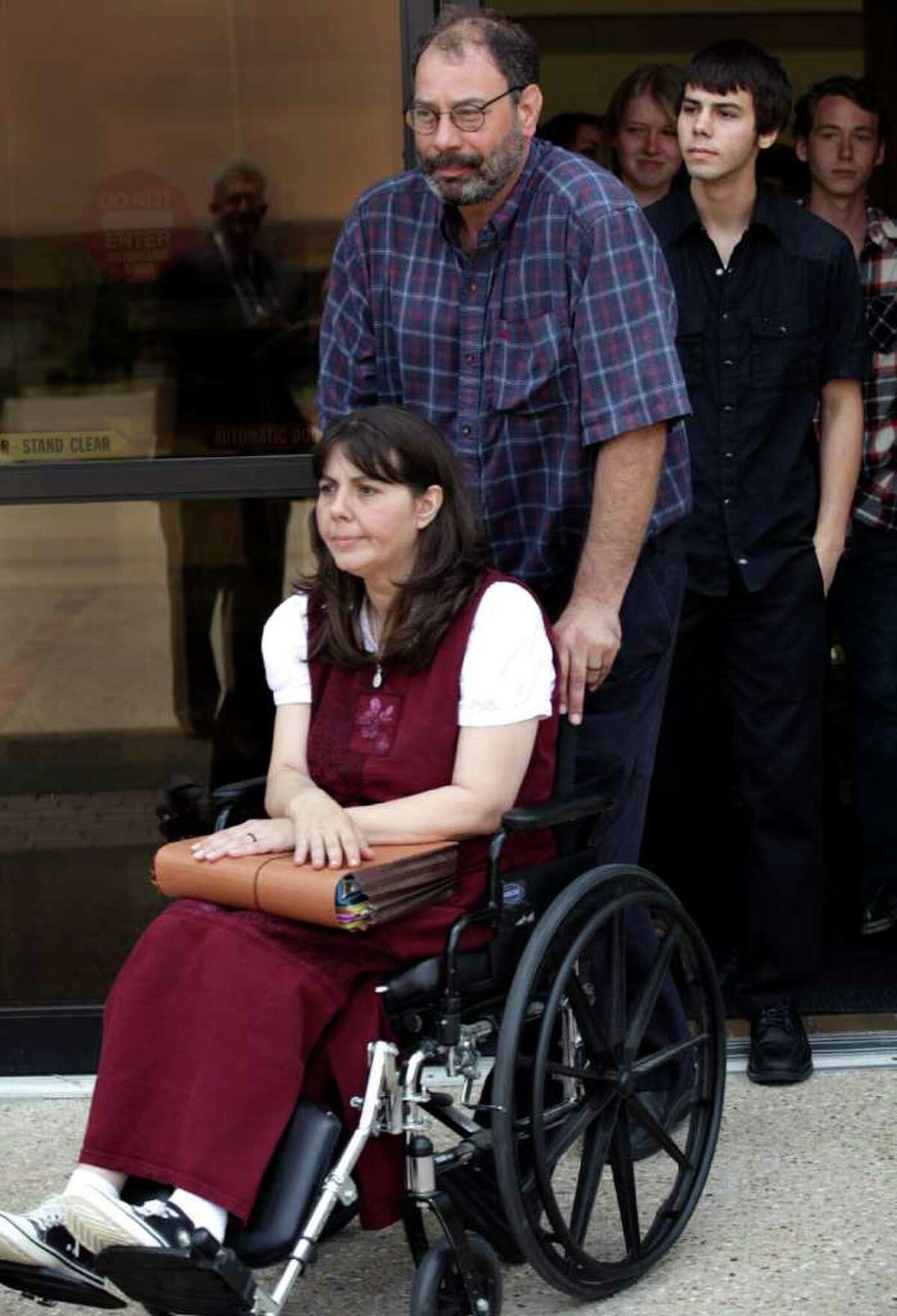 Danny Schultz escorts his wife Christa Schultz followed by their son Corwyn Schultz leave the U.S. Courthouse in San Antonio, May 31, after a hearing in which they are trying to ban the use of prayer during Medina Valley High School's graduation ceremonies this Saturday. Corwyn is in the graduating class.