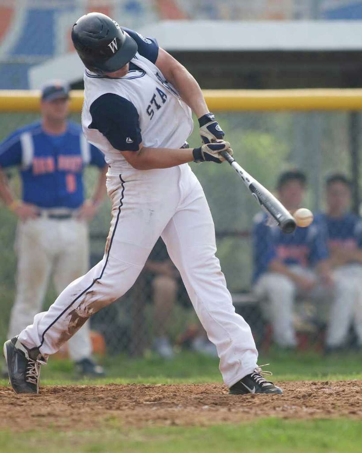Staples' Brian Terzian makes contact on a pitch against Danbury during the Class LL state tournament second round game Wednesday at Danbury High School.