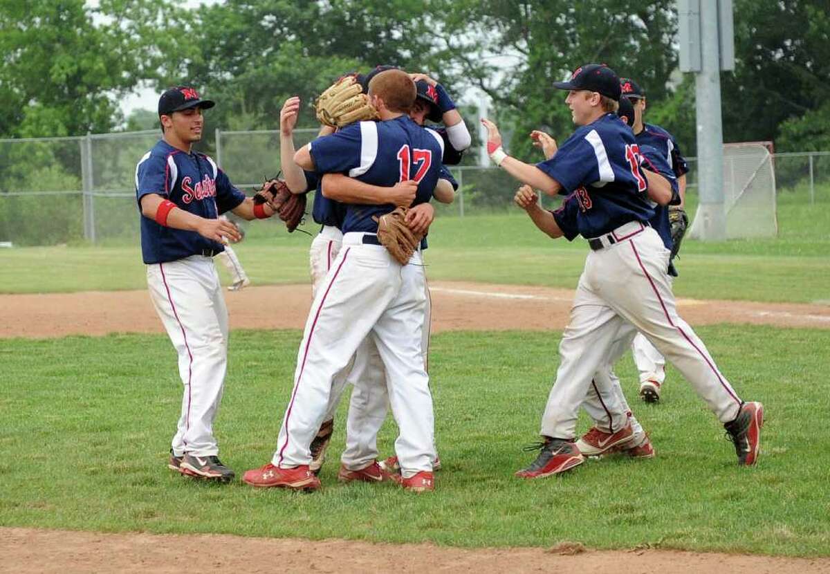 McMahon's players celebrate their win after Wednesday's Class LL baseball game at Brien McMahon High School on June 1, 2011.