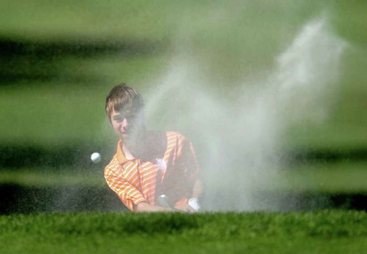 Ridgefield's Rory Mazur hits his ball out of the sand on the ninth hole during the FCIAC championship golf tournament Thursday, June 2, 2011 at Fairchild Wheeler Golf Course in Fairfield, Conn.