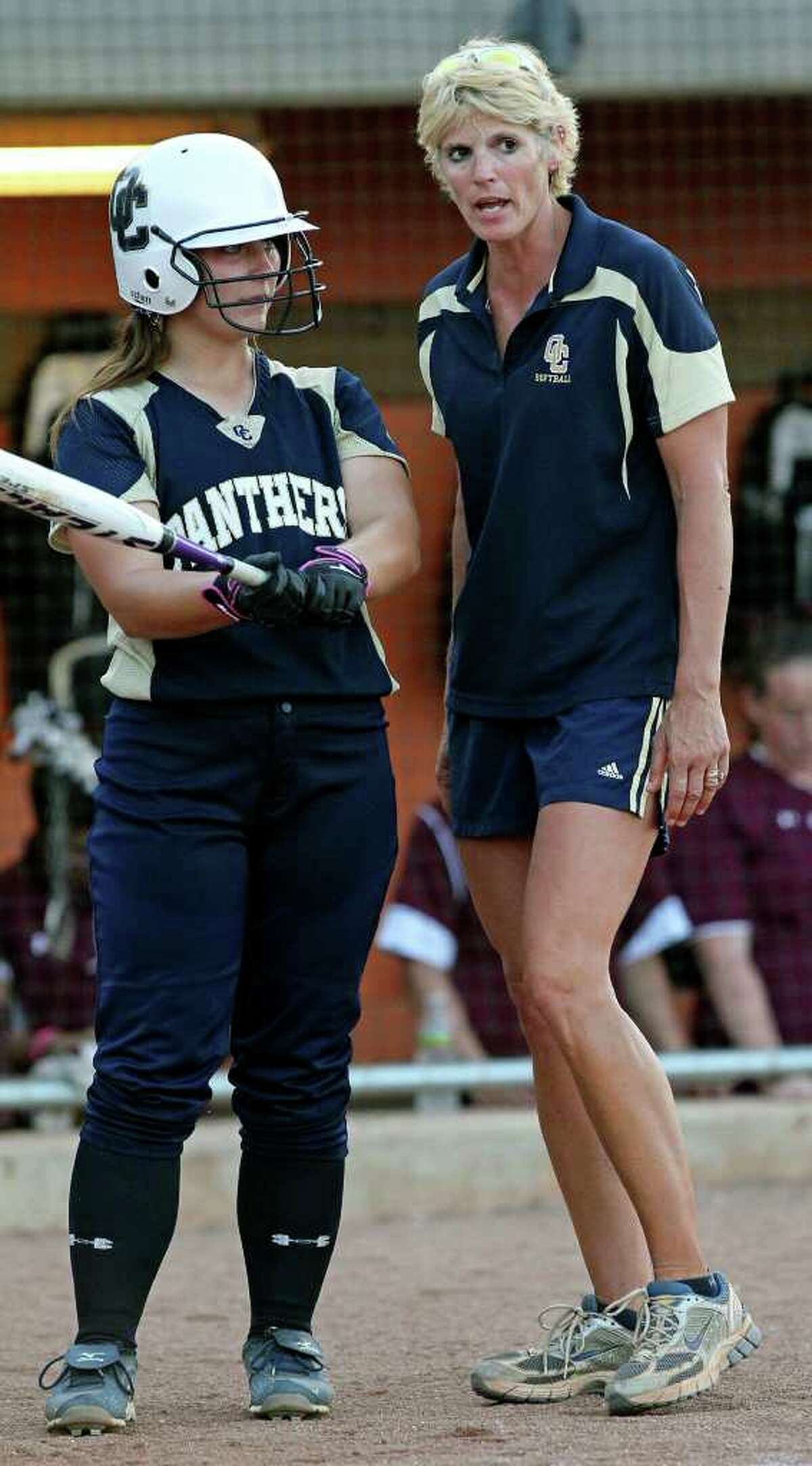 Coach Anne Lewis gives batting instructions as O'Connor plays Plano in the state softball semifinals at McCombs Field in Austin on June 3, 2011. Tom Reel/Staff