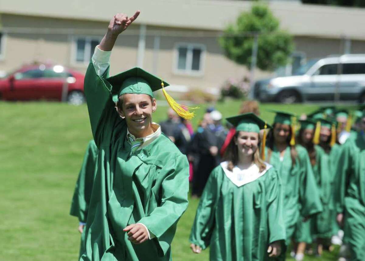 Stephen Heaslip waves to the crowd as the Trinity Catholic High School Class of 2011 processes in for the Commencement Exercises in Stamford, Conn. on Saturday June 4, 2011.
