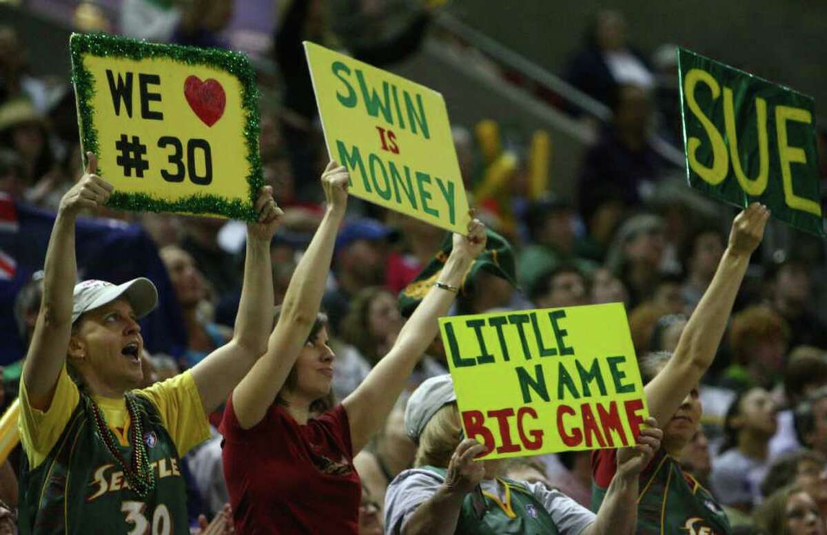 Seattle Storm fans cheer as the Storm begin the WNBA season against the Phoenix Mercury on Saturday, June 4, 2011 at KeyArena in Seattle. The storm beat the Mercury 78-71.