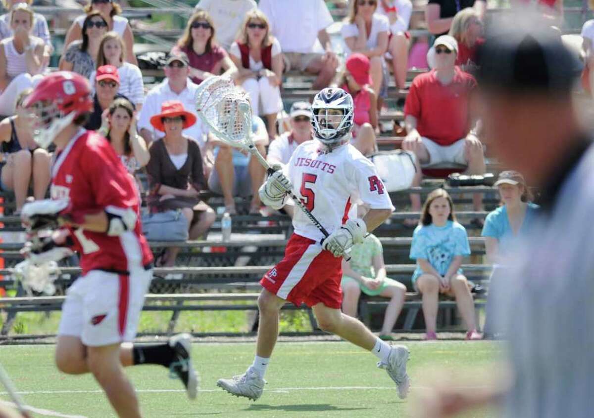 Fairfield Prep goalie Mike Seelye, # 5, takes it out to mid-field during the Class L boys lacrosse quarterfinal between Fairfield Prep and Greenwich High School at Fairfield University, Saturday afternoon, June 4, 2011.