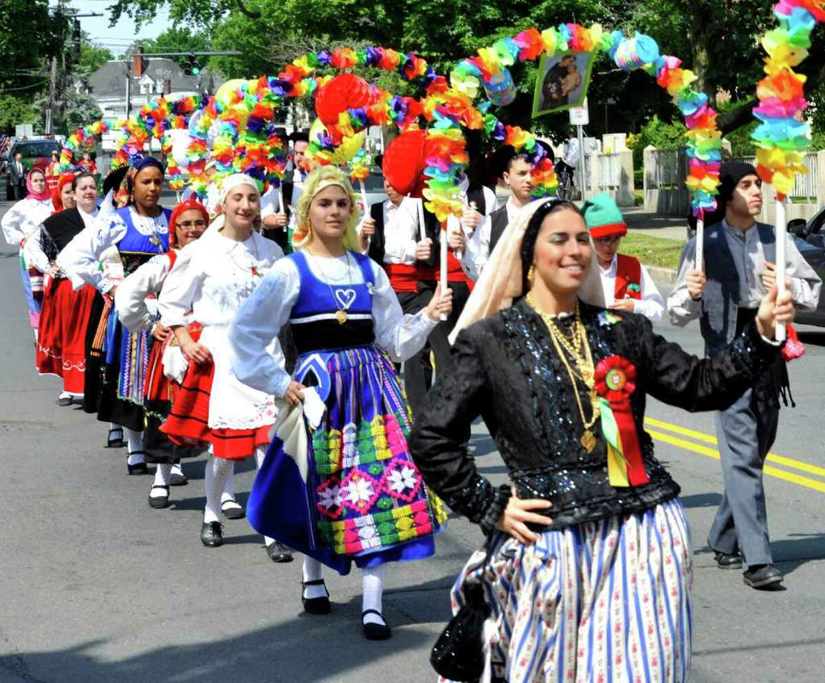 The Sons of Portugal Folklore Dancers, including Joelle Martin, front right, march in the Portuguese Day Parade in Danbury, Sunday, June 5, 2011.