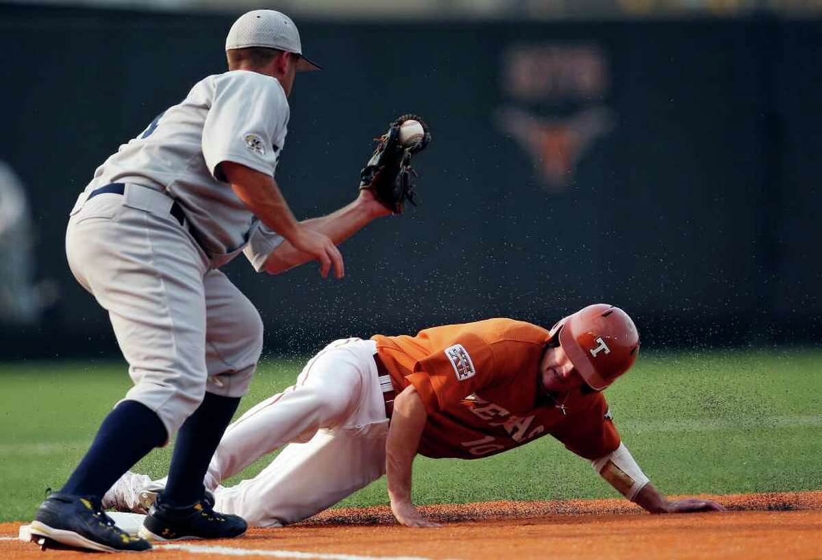 Texas' Brandon Loy steals third base under Kent State's Travis Shaw during the first inning.