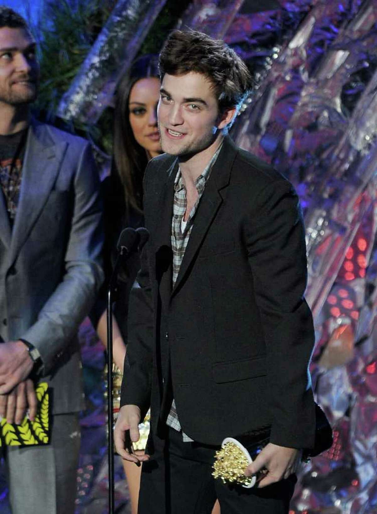 Actor Robert Pattinson accepts the Best Male Performance onstage.