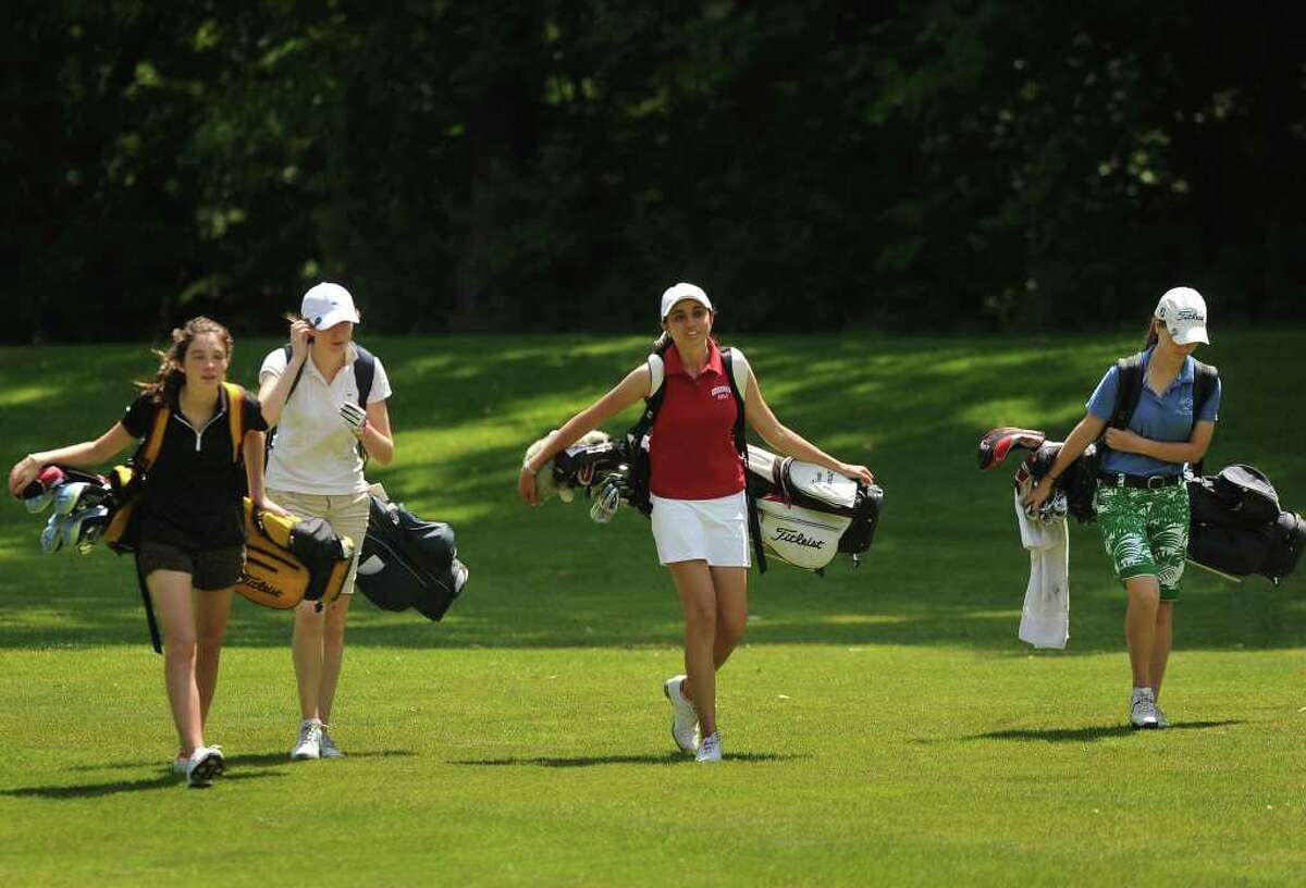 From left; Trumbull's Lauren Gregory, Staples' Kim Hynes, Greenwich's Brooke Nethercott, and Avon's Alexa Gentile walk up the second fairway at the 2011 Girls Golf State Tournament at Orange Hills Country Club in Orange on Tuesday, June 7, 2011.