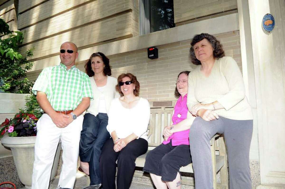 Rose Marzullo's family members sit on a bench dedicated by the Senior Center in Marzullo's memory Tuesday, June 7, 2011. From left, Marzullo's son, Jim, and daughters Catherine LiVolsi, Diane Olivo, Joanna Sweet, and Christine Krieg. The center dedicated a second bench in memory of Rose's twin sister, Carmela Pecora.