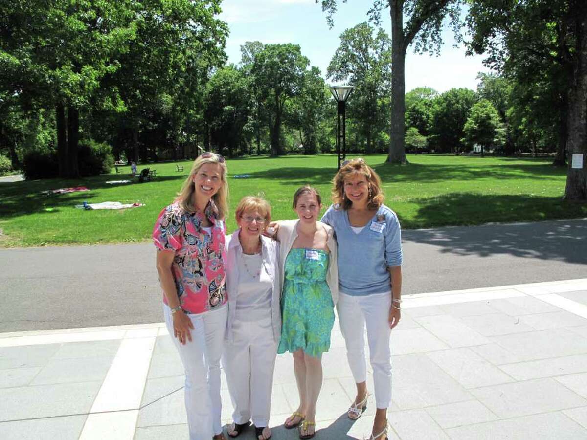 From left to right: Elizabeth Perkins (a board member), Helen Palmesi (retiring director), Meghan Martucci (a board member), and Leighanne Champion (founding board member). Perkins, Martucci and Champion help put together the retirement picnic for Palmesi.