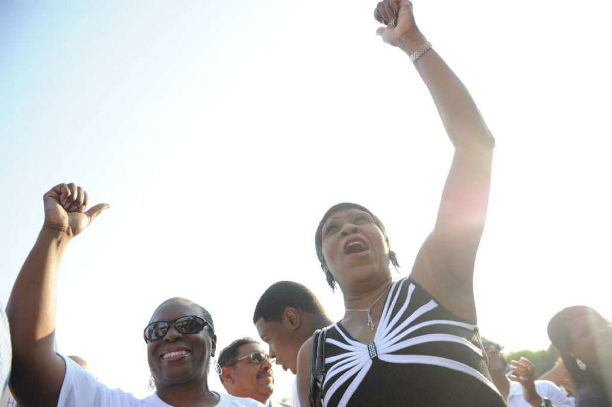 Cynthia Jennings, civil rights attorney, left, and Carroll Brown, president of the West Haven Black Coalition, cheer during the NAACP "Equal Education for All" rally at Brookside Elementary School in Norwalk, Conn., Tuesday, June 7, 2011. The rally was in support of Tanya McDowell, a homeless woman from Bridgeport, Conn., arrested for enrolling her child at Brookside, a Norwalk, Conn., school. Rev. Al Sharpton spoke at the event.