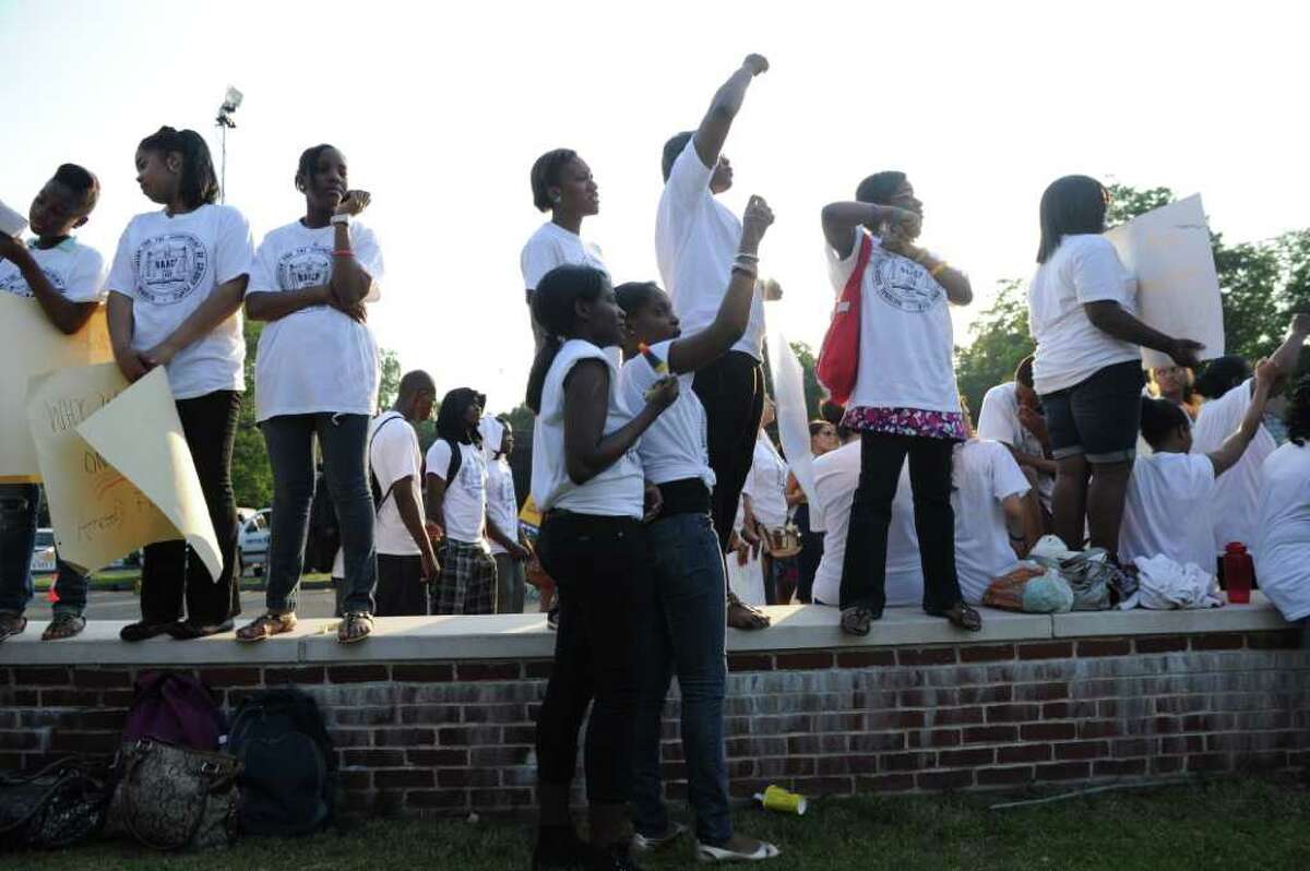 Students from Stamford, Conn., cheer during the NAACP "Equal Education for All" rally at Brookside Elementary School in Norwalk, Conn., Tuesday, June 7, 2011. The rally was in support of Tanya McDowell, a homeless woman from Bridgeport, Conn., arrested for enrolling her child at Brookside, a Norwalk, Conn., school. Rev. Al Sharpton spoke at the event.