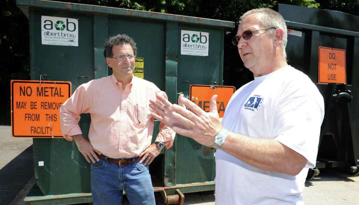 Jay Lewin, left, a long-time recycling volunteer and member of the New Milford's Recycling Committee, and Bob Hanna, a retired Waste Management employee who has served on the town's Recycling Committee, are pictured at the New Milford Recycling Center. Photo taken Tuesday, May 31, 2011