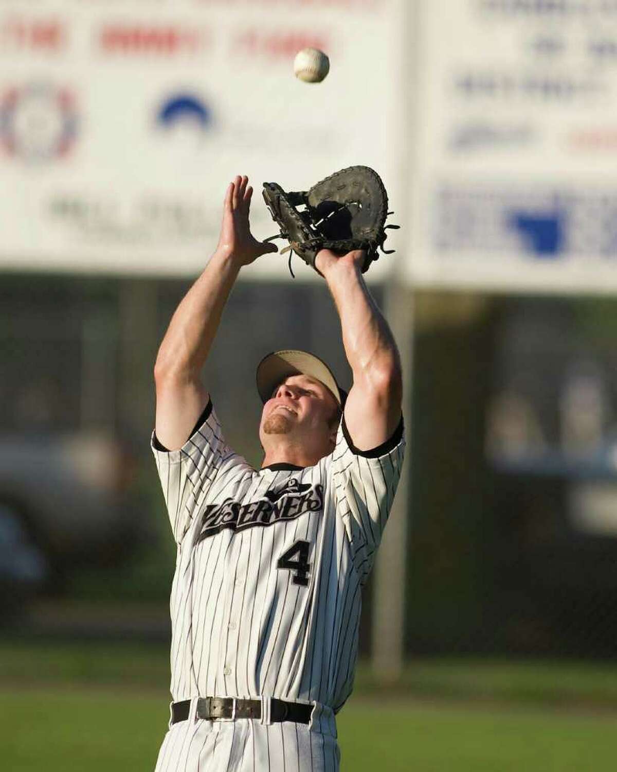 Westerners' first baseman Dave Ciocchi grabs a pop in foul territory against Briston Tuesday night at Rogers Park.