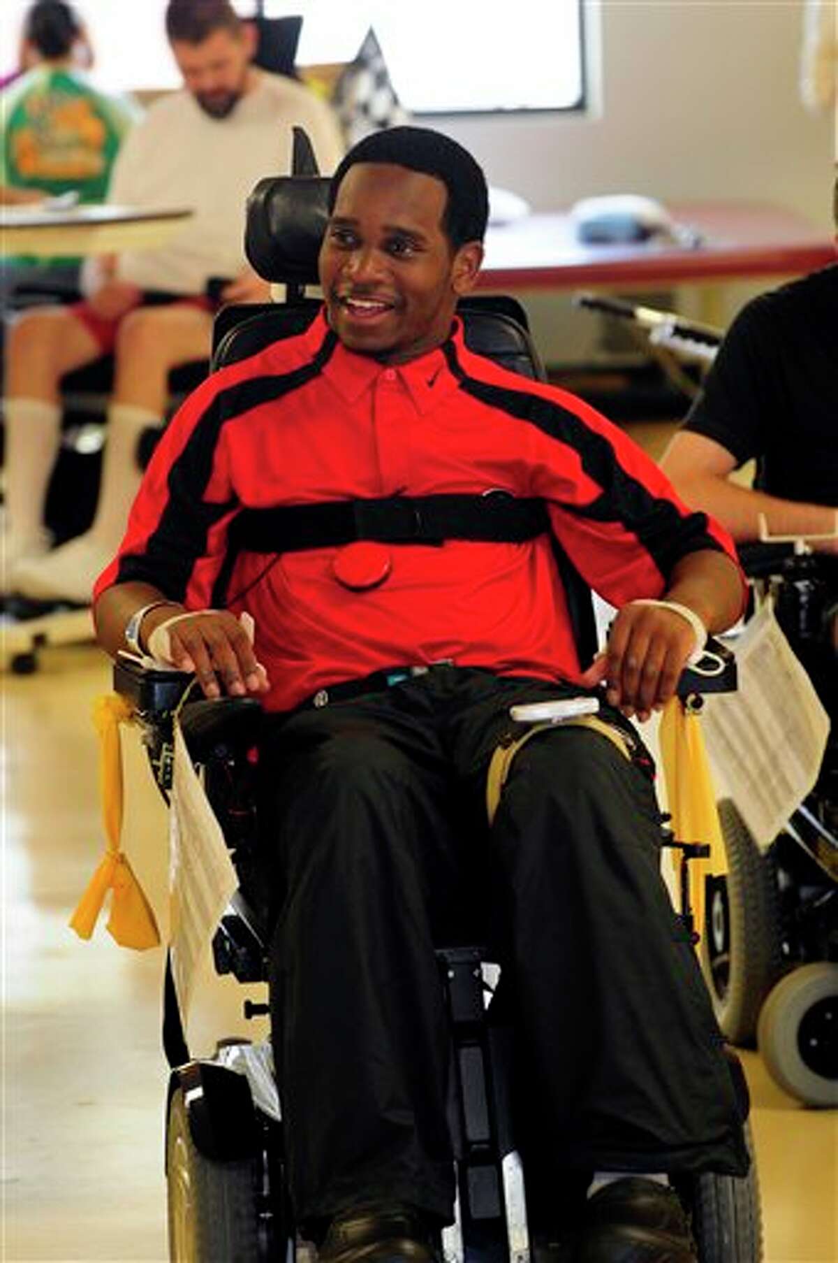 In this May 24, 2011 file photo, Georgia baseball player Johnathan Taylor is released from the Shepherd Center in Atlanta. Taylor was drafted by the Texas Rangers in the 33rd round of Major League Baseball's draft on Wednesday June 8, 2011, although he suffered a career-ending neck injury in a March 6, 2011 baseball game against Florida State when he collided with teammate Zach Cone in the third inning. Cone was also drafted by the Texas Rangers. AP Photo/Athens Banner-Herald, David Tulis