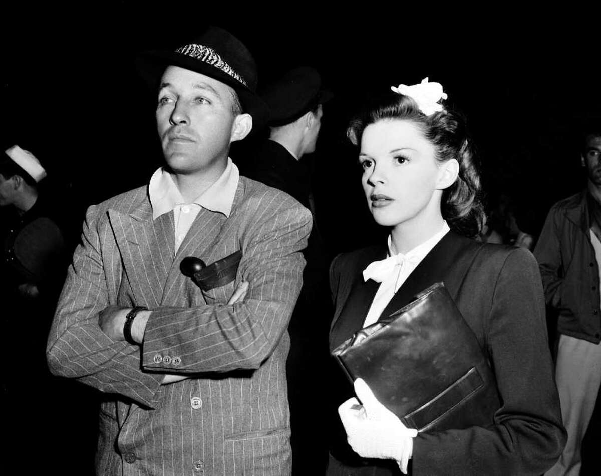 Singer-actor Bing Crosby, left, visits singer-actress Judy Garland on the set of "The Harvey Girls" in Hollywood, Ca., in 1945.