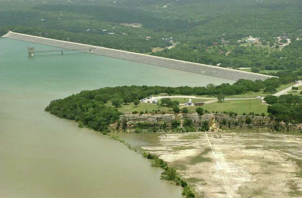 Photos show Canyon Lake, Canyon Dam under construction during the 1960s