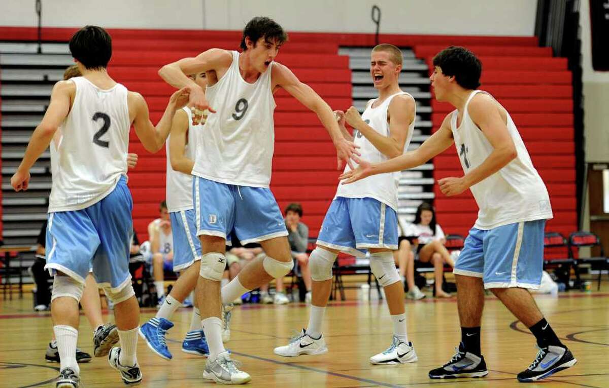 Darien players celebrate a point during Friday's class M championship game at Fairfield Warde High School on June 10, 2011.