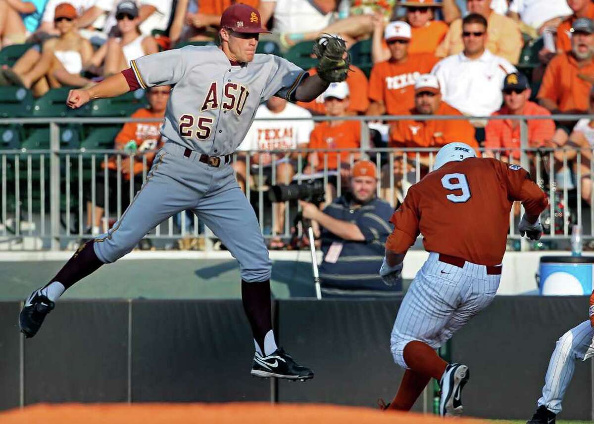 SPORTS Longhorn runner Tant Shepard makes it safe to first under the tag of Zach Wilson as The University of Texas Longhorns play Arizona State at Disch-Falk Field in Austin on June 10, 2011. Tom Reel/Staff