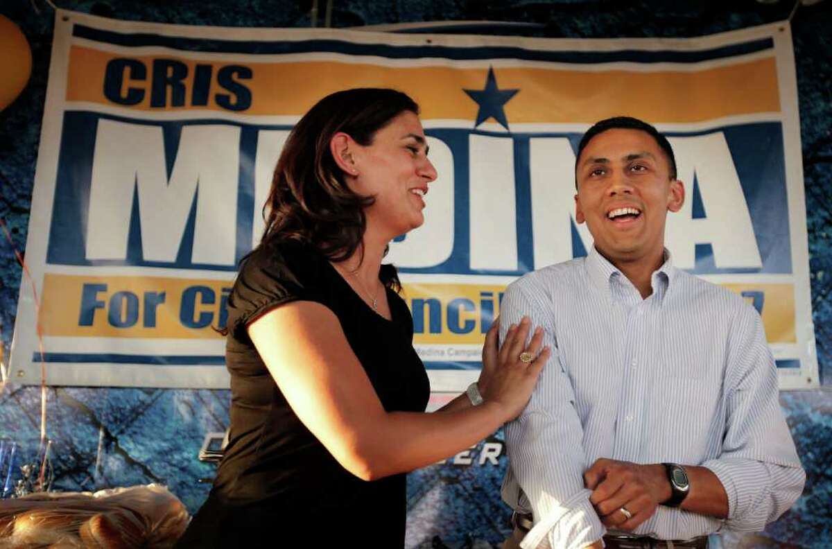 City council district 7 councilman-elect Cris Medina, right, speaks to a gathering of supporters with his campaign treasurer, Victoria Rodriguez, after receiving notice of his victory in the district 7 runoff election, Saturday, June 11, 2011, in San Antonio.