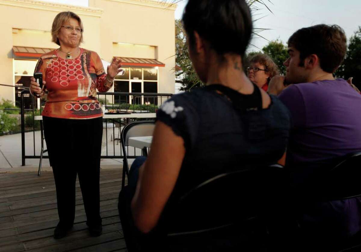City council district 7 candidate Elena Guajardo, left, speaks to a gathering of supporters after receiving notice of her loss in the district 7 runoff election, Saturday, June 11, 2011, in San Antonio.