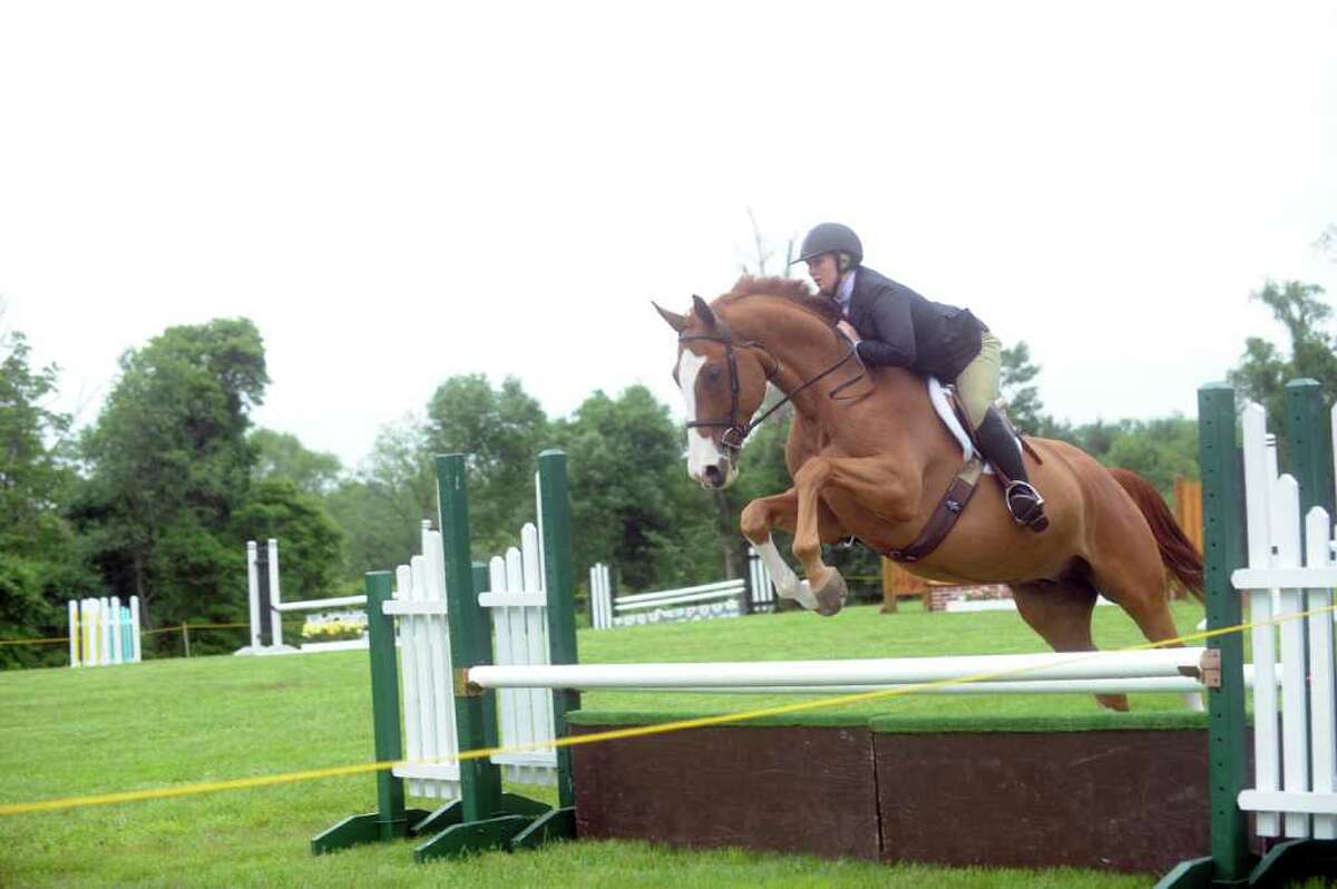 Jen Roche, 24, of Easton, jumping at the Greenwich Riding and Trails Association’s 90th annual Greenwich Horse Show at the estate of Mr. and Mrs. Gerrish Milliken on Pierson Drive, in Greenwich, Sunday, June 12, 2011.