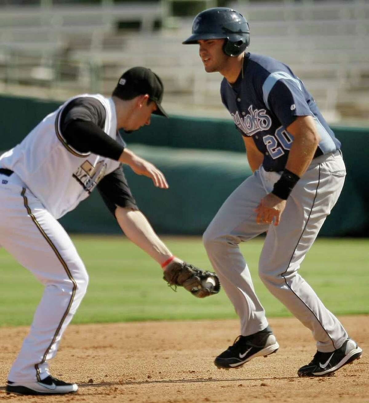 Corpus Christi Hooks' J.D. Martinez, right, is forced out at second by San Antonio MIssions' Anthony Contreras during a Texas league baseball game, Sunday, June 12, 2011, in San Antonio. San Antonio won 6-4.