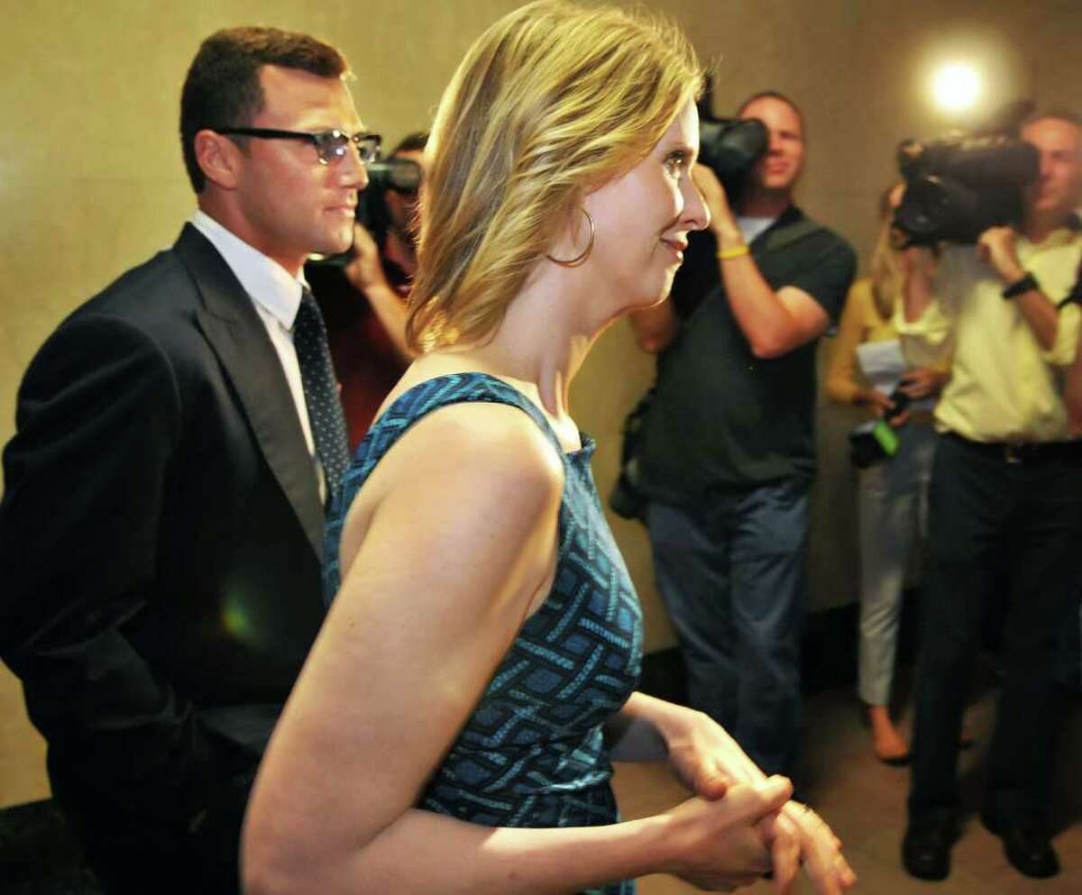 New York Rangers player Sean Avery, left, and ?Sex and The City? star Cynthia Nixon make their way to a news conference calling on the state legislature to legalize same-sex marriage at the Capitol Tuesday June 14, 2011. (John Carl D'Annibale / Times Union)