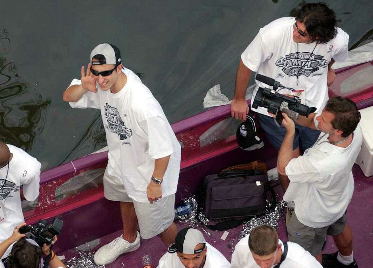 METRO - Manu Ginobili listens to the crowd cheer Wed. June 18, 2003 during the Spurs Parade on the Riverwalk. KEVIN GEIL/STAFF
