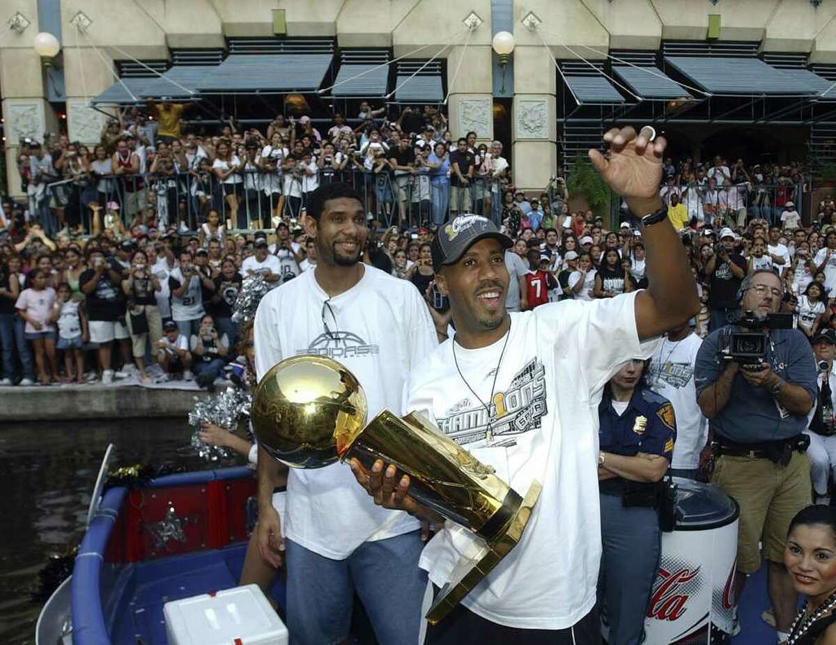 FOR METRO - Spurs' Tim Duncan and Bruce Bowen celebrate during the championship parade through the River Center Lagoon Saturday June 25, 2005. FOR PHOTO BY EDWARD A. ORNELAS