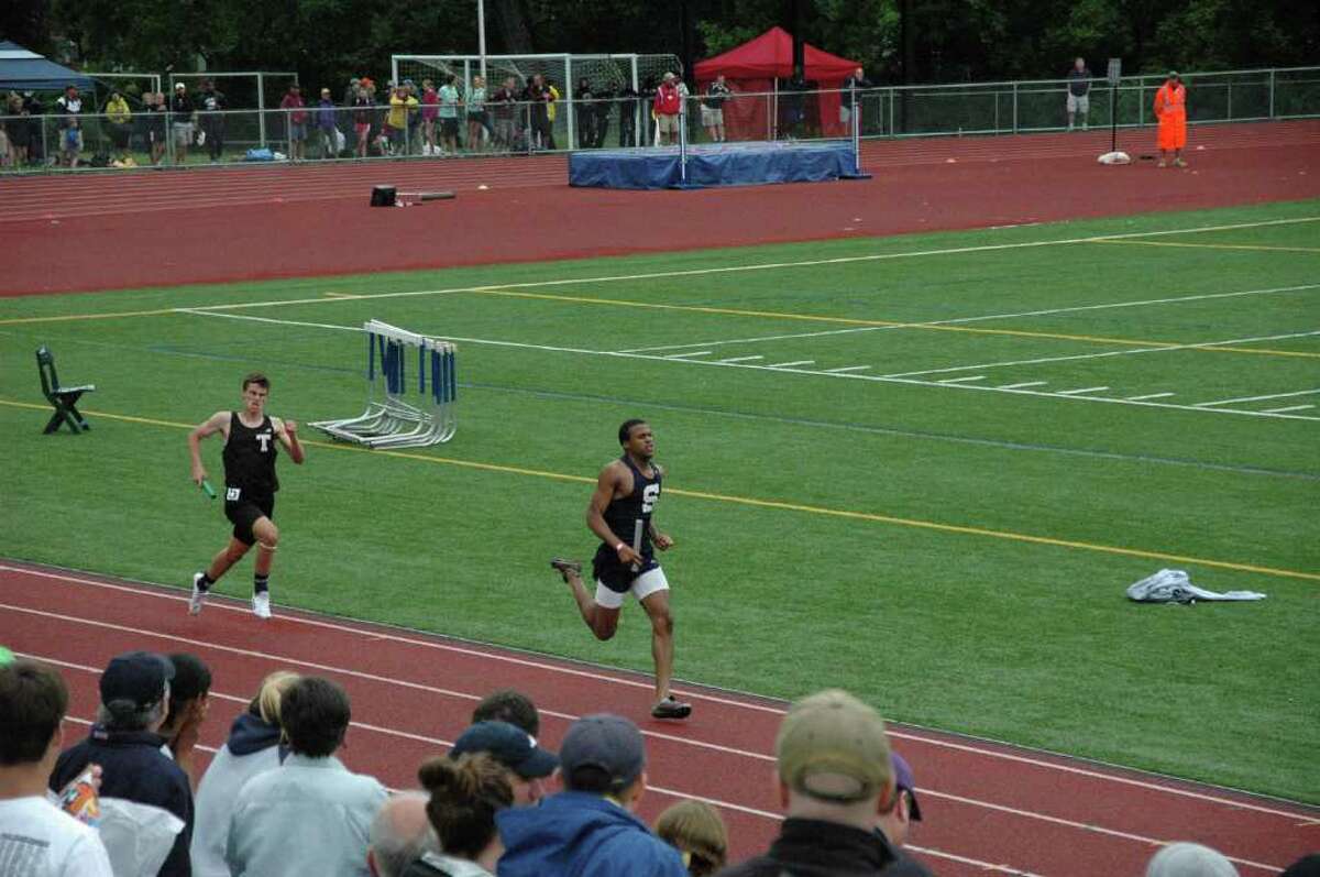 Staples senior captain anchors the 4x400 meter relay team to victory at the New England championships Saturday. Ray ran a 47.5 split and the relay set a school record (3:19.26).