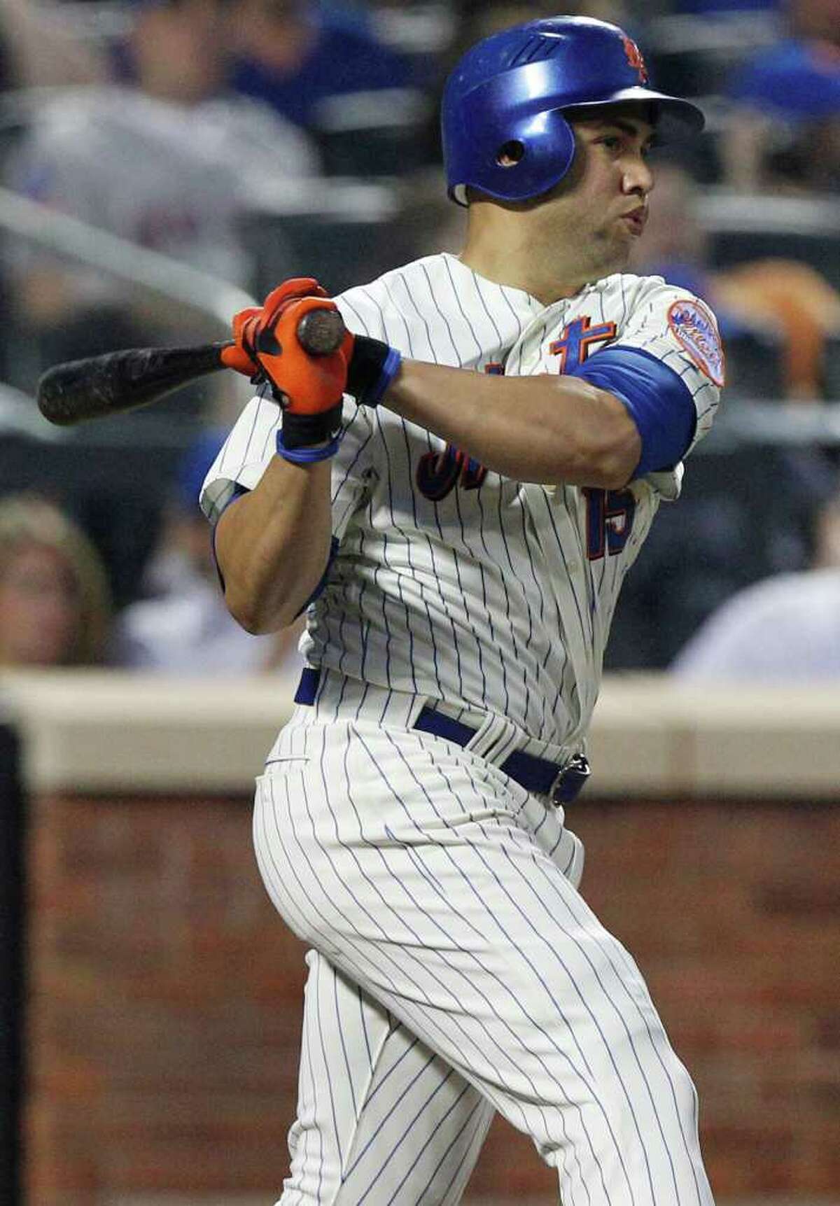 New York Mets' Carlos Beltran follows through on a two run home run during the fifth inning of an interleague baseball game against the Los Angeles Angels Saturday, June 18, 2011, at Citi Field in New York. (AP Photo/Frank Franklin II)