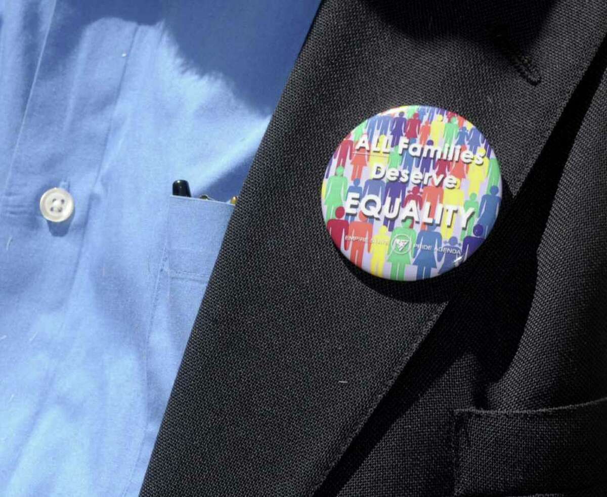 A button is worn by a supporter during a rally in support of gay marriage outside of First United Presbyterian Church on Sunday, June 19, 2011 in Troy. The rally was held by various area churches and some of their congregation members. Rallies like this one were held at churches around the state on Sunday. (Paul Buckowski / Times Union)