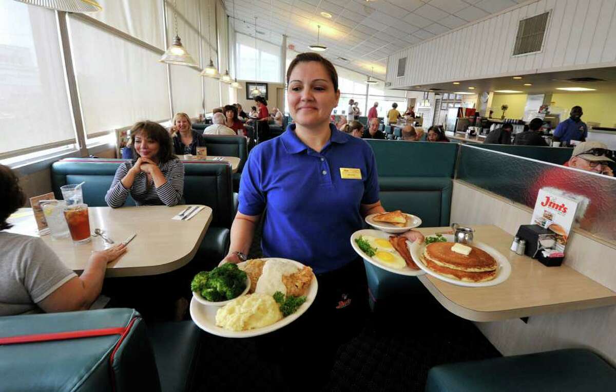 Jo Ann Flores serves breakfast at the original Jim’s restaurant on Broadway at Loop 410.