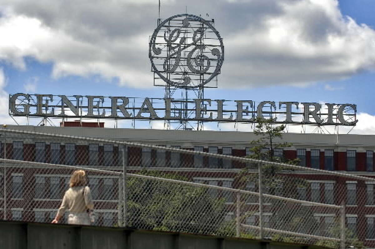 A pedestrian crosses the bridge just outside of the entrance on Edison Avenue to the General Electric facility in Schenectady, NY on Thursday July 10, 2008. (Philip Kamrass / Times Union)