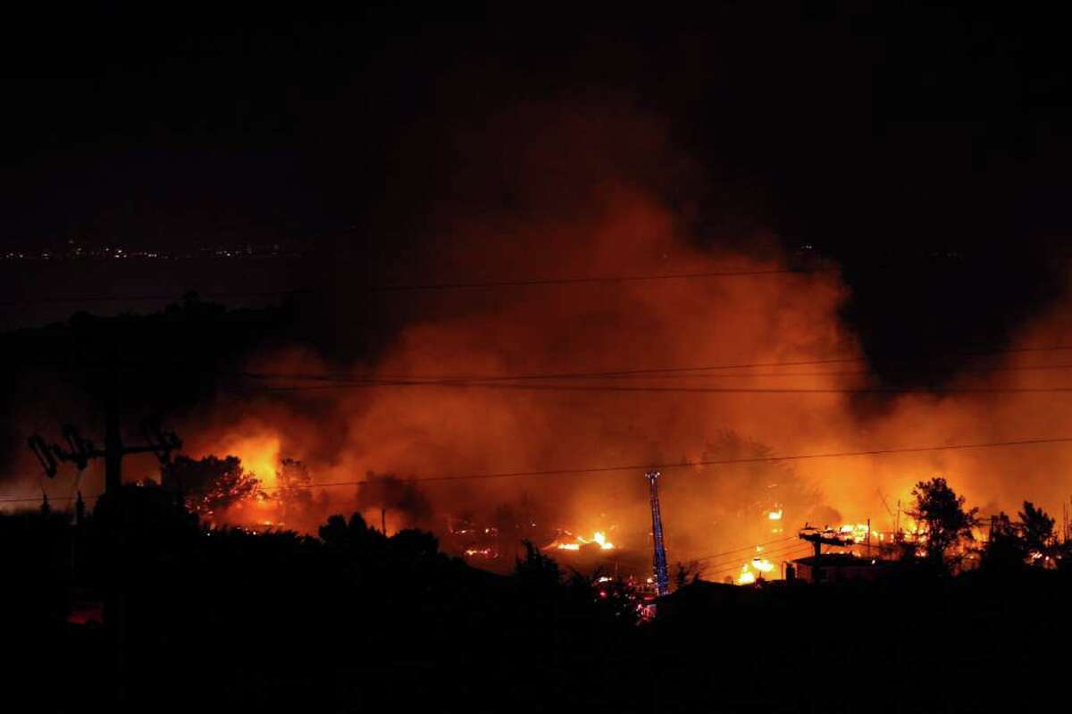 Flames consume homes during a massive fire in a residential neighborhood September 9, 2010 in San Bruno, California. A massive gas line explosion likely rocked a neighborhood near San Francisco International Airport. (Photo by Ezra Shaw/Getty Images)