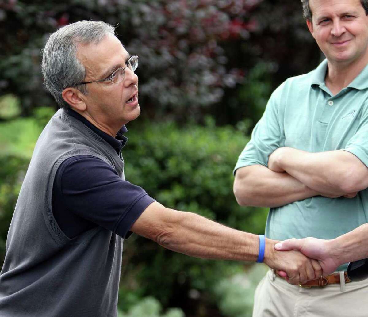 NY sports journalist Mike Lupica greets a guest at the annual Mike Lupica/Fred Wilpon golf outing at Fairview Country Club in Greenwich, Conn. on Monday June 20, 2011. The event is a fundraiser for the Special Olympics.